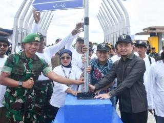 Pj Bupati Kampar Gaungkan Semangat Gotong Royong di Festival Danau Bokuok